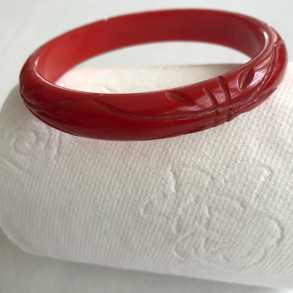 Vintage Bakelite cherry red carved bangle bracelet.